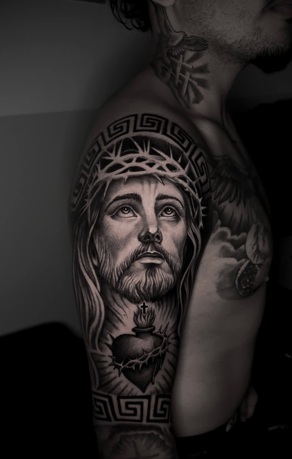 Christ with sacred heart and Greek key band, upper arm