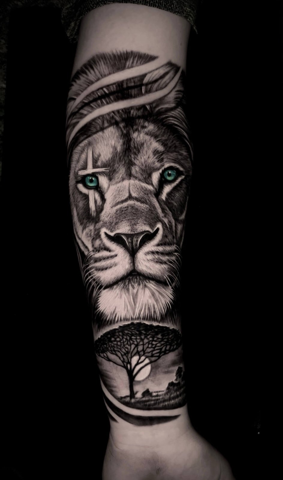 Lion with savanna landscape, forearm